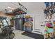 Garage with lots of storage, overhead storage, a golf cart, and work bench at 510 33Rd N Ave, St Petersburg, FL 33704
