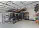 Well-organized garage with storage cabinets, bikes, and an electric golf cart at 510 33Rd N Ave, St Petersburg, FL 33704