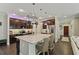 Gourmet kitchen featuring a large island, stainless steel appliances, and dark wood cabinetry at 510 33Rd N Ave, St Petersburg, FL 33704