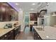 Well-equipped kitchen features granite countertops, stainless appliances, and ample dark wood cabinetry at 510 33Rd N Ave, St Petersburg, FL 33704