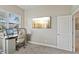 Inviting home office with a wall-mounted TV, adjacent to a bedroom at 510 33Rd N Ave, St Petersburg, FL 33704