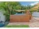 Charming above ground pool area with wood deck, privacy fence, and relaxing shade sails at 510 33Rd N Ave, St Petersburg, FL 33704