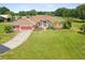 Charming single-story home boasting an attached garage and lush lawn at 5100 Lockhart Rd, Brooksville, FL 34602