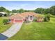 Charming single-story home boasting an attached garage and lush lawn at 5100 Lockhart Rd, Brooksville, FL 34602