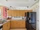 Well-equipped kitchen with ample counter space, storage, and a black refrigerator at 5100 Lockhart Rd, Brooksville, FL 34602