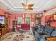 Inviting living room featuring a unique ceiling fan and decor, and an open entryway to the home at 5100 Lockhart Rd, Brooksville, FL 34602