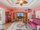 Comfortable living room with hardwood floors, fireplace, ceiling fan, and a cozy rug at 5100 Lockhart Rd, Brooksville, FL 34602