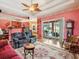 Cozy living room featuring hardwood floors, comfortable seating and a view of the pool and outdoor area at 5100 Lockhart Rd, Brooksville, FL 34602