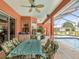 Outdoor patio featuring seating, a barbecue, and view of the pool in a screened enclosure at 5100 Lockhart Rd, Brooksville, FL 34602