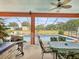 View of the screen-enclosed pool area featuring a pool, a shed, and outdoor seating at 5100 Lockhart Rd, Brooksville, FL 34602