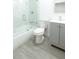 Modern bathroom features a shower over tub, vanity and a sleek toilet at 5510 12Th St, Zephyrhills, FL 33542