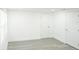 White interior with new grey laminate floors and white doors at 5510 12Th St, Zephyrhills, FL 33542