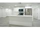 Modern kitchen with stainless steel appliances, a large island, and white cabinets at 5510 12Th St, Zephyrhills, FL 33542