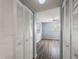 Hallway view featuring closet and view of the living room with lots of natural light at 6324 Newtown Cir # 24B1, Tampa, FL 33615