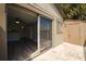 Private patio with sliding glass doors leading to living area and storage space at 6324 Newtown Cir # 24B1, Tampa, FL 33615