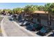 Street view of condo buildings, parking and palm trees, showing well-maintained landscaping at 6324 Newtown Cir # 24B1, Tampa, FL 33615