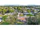 Aerial view of the property showcasing landscaping, nearby homes, and water features at 6334 Hyperion Dr, Port Richey, FL 34668