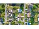 Overhead view of homes and a street with ponds and lush green spaces nearby at 6334 Hyperion Dr, Port Richey, FL 34668