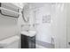 This bathroom features a small sink, modern fixtures, and a walk-in shower with stylish tile work at 6334 Hyperion Dr, Port Richey, FL 34668