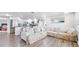 Inviting living room flows to a modern kitchen with stainless steel appliances and an island at 6334 Hyperion Dr, Port Richey, FL 34668