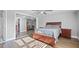 Spacious bedroom with a neutral color scheme, ceiling fan, and hardwood floors, creating a tranquil retreat at 6334 Hyperion Dr, Port Richey, FL 34668