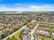 Community aerial showcasing colorful townhomes, manicured lawns, and a Gathering-friendly neighborhood near a lake at 6974 Holly Heath Dr, Riverview, FL 33578