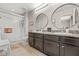 Bathroom featuring double sinks, granite countertops, and a glass shower at 6974 Holly Heath Dr, Riverview, FL 33578