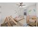 Bright bedroom featuring a modern ceiling fan, playful décor, and a comfortable bed at 6974 Holly Heath Dr, Riverview, FL 33578