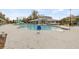 Community pool with splash pad, play area, and lounge seating at 6974 Holly Heath Dr, Riverview, FL 33578