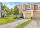 Well-maintained townhome with lush front lawn and convenient two-car garage in a desirable community at 6974 Holly Heath Dr, Riverview, FL 33578