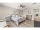 Comfortable bedroom with a ceiling fan and neutral tones at 6974 Holly Heath Dr, Riverview, FL 33578