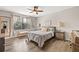 Relaxing bedroom with a ceiling fan, neutral tones, and natural light at 6974 Holly Heath Dr, Riverview, FL 33578