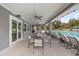 Covered outdoor seating area with ceiling fans and views of the community pool at 6974 Holly Heath Dr, Riverview, FL 33578