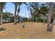 Wood mulch playground with swings, slides, and climbing features at 6974 Holly Heath Dr, Riverview, FL 33578