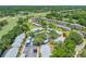 Desirable community with mature trees, carports, and well maintained landscaping from an aerial view at 70 Cypress Pl, Oldsmar, FL 34677