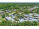 Desirable community with mature trees, carports, and well maintained landscaping from an aerial view at 70 Cypress Pl, Oldsmar, FL 34677