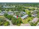 Desirable community with mature trees, carports, and well maintained landscaping from an aerial view at 70 Cypress Pl, Oldsmar, FL 34677