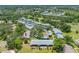 Desirable community with mature trees, carports, and well maintained landscaping from an aerial view at 70 Cypress Pl, Oldsmar, FL 34677