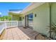 Private back patio with tile flooring and a white fence, perfect for outdoor relaxation at 70 Cypress Pl, Oldsmar, FL 34677