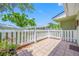 Serene back patio offering privacy with a white fence, ideal for enjoying the outdoors at 70 Cypress Pl, Oldsmar, FL 34677