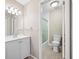 Bathroom with a white vanity, updated fixtures, and toilet next to a shower and tub combination at 70 Cypress Pl, Oldsmar, FL 34677