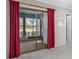 Primary bedroom with sliding glass door that leads to an enclosed lanai at 70 Cypress Pl, Oldsmar, FL 34677