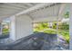 Well-maintained carport with storage and adjacent green space at 70 Cypress Pl, Oldsmar, FL 34677