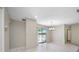 Open dining area with tile flooring and sliding doors to the outdoor patio at 70 Cypress Pl, Oldsmar, FL 34677