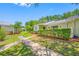 Well-maintained exterior with green lawn and mature plantings at 70 Cypress Pl, Oldsmar, FL 34677