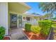 Welcoming front porch with decorative accents, including a wreath and a small picket fence at 70 Cypress Pl, Oldsmar, FL 34677