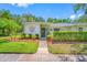 Charming home featuring a meticulously maintained front yard with vibrant green grass and decorative landscaping at 70 Cypress Pl, Oldsmar, FL 34677