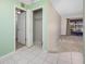 Entryway featuring tile flooring and view of bedroom and closet with sliding doors at 70 Cypress Pl, Oldsmar, FL 34677