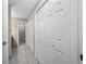 Hallway with access to the bathroom and multiple closets for linens and storage at 70 Cypress Pl, Oldsmar, FL 34677