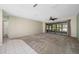 Spacious living room featuring sliding glass doors leading to the outdoors, and neutral decor at 70 Cypress Pl, Oldsmar, FL 34677